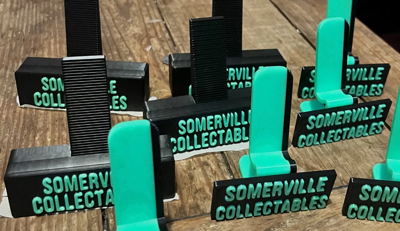 A collection of the first card stands, shown on my coffee table before being sent